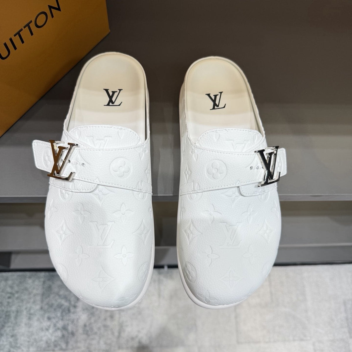 Louis Vuitton White Embossed Slide Sandals — hero