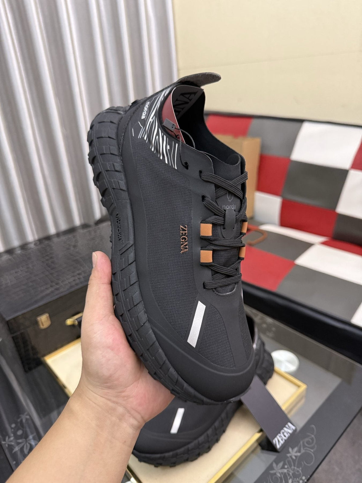 ZEGNA Black Trail Running Shoes with Orange Accents — model