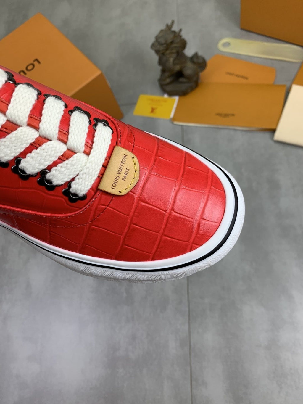 Louis Vuitton Red Embossed Low-Top Sneakers — detail
