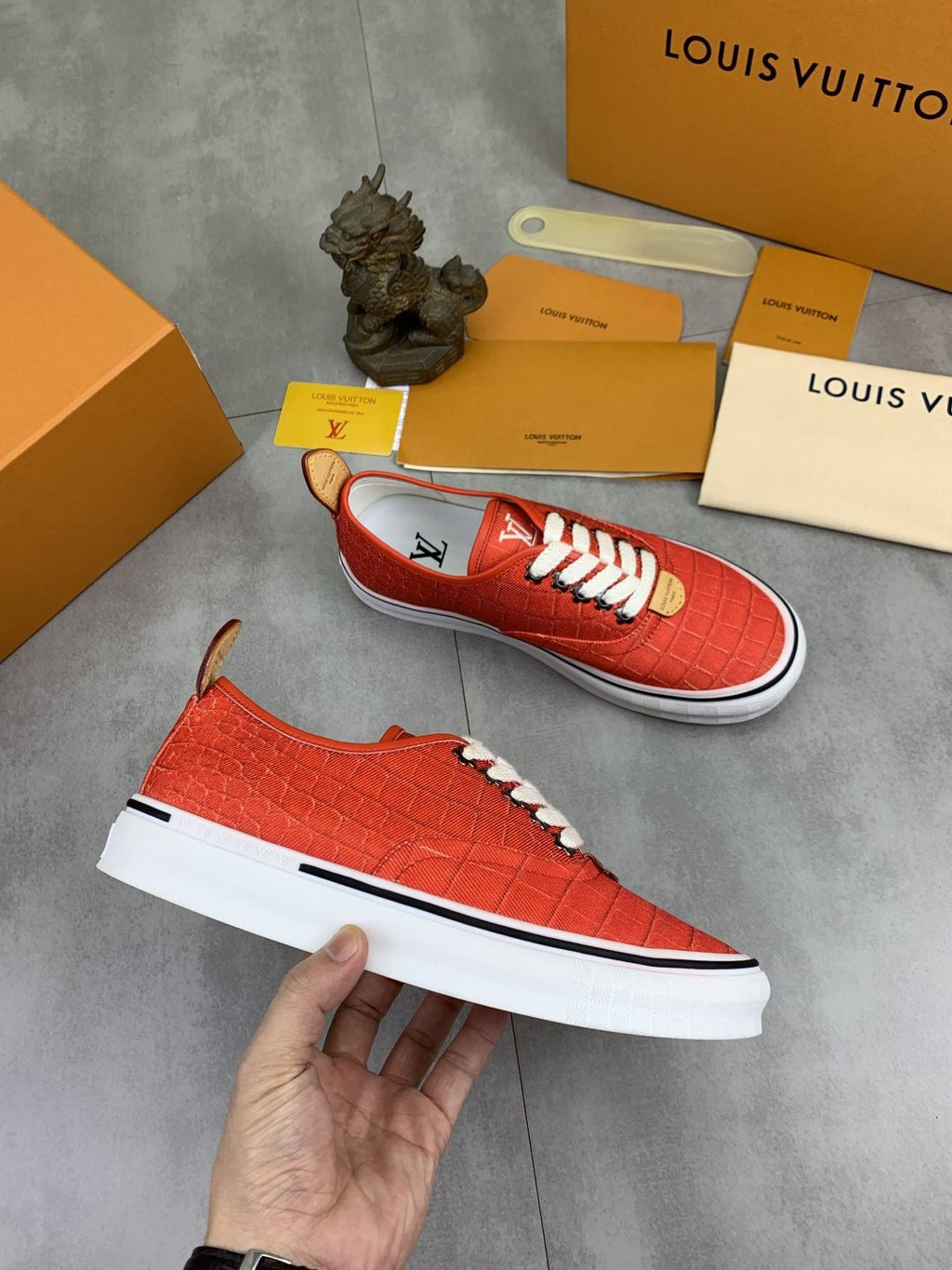 Louis Vuitton Coral Red Textured Low-Top Sneakers — model
