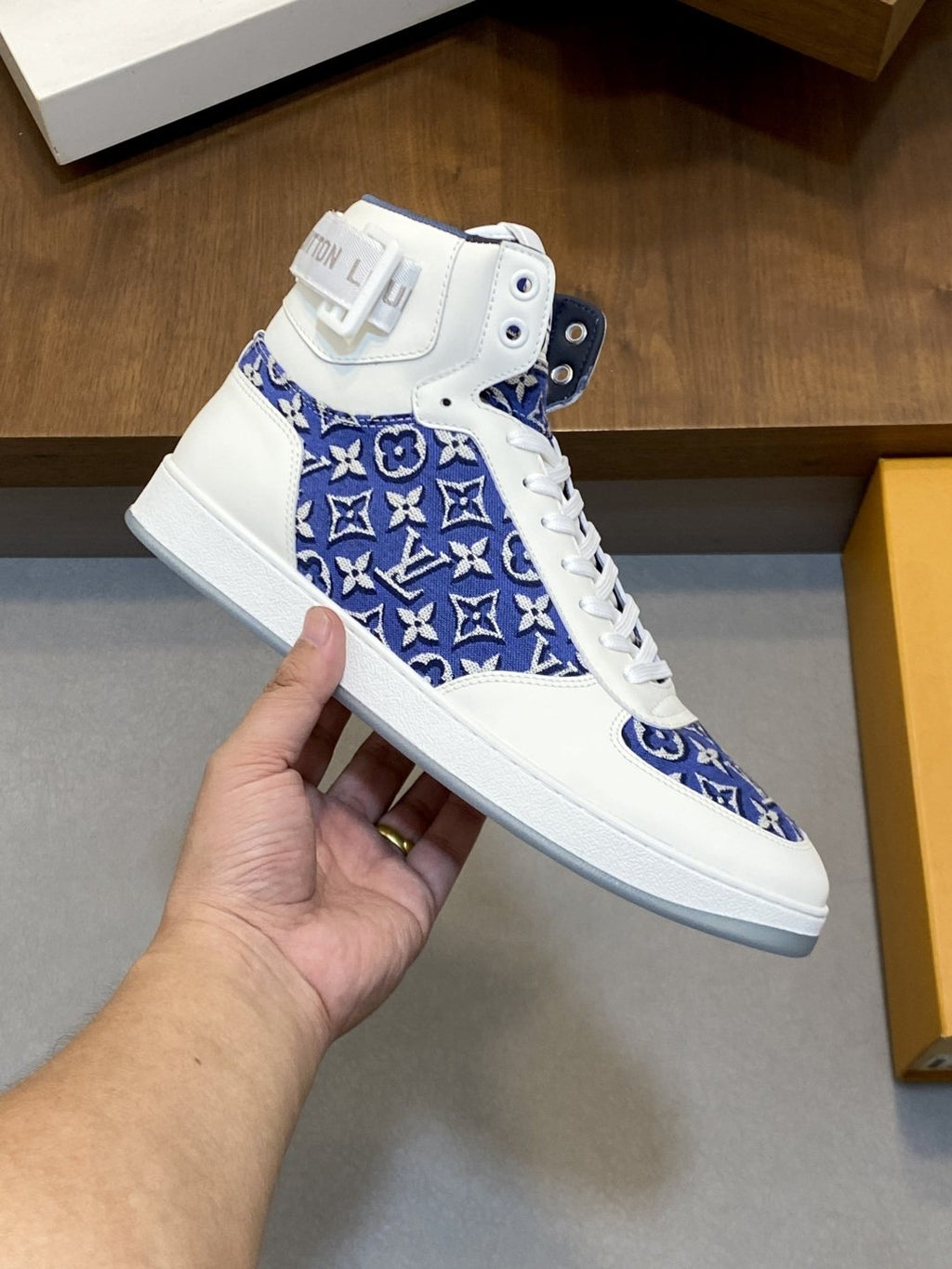 Louis Vuitton Rivoli Patterned High-Top Sneakers — model
