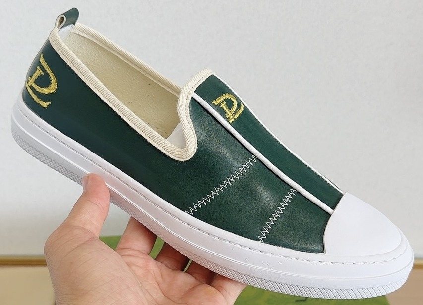 Gucci Brown Slip-On Sneakers with White Toe Caps — front