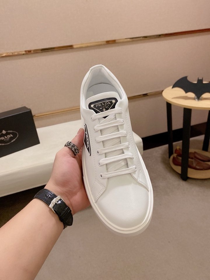Prada Plaque Low-Top Sneakers — model